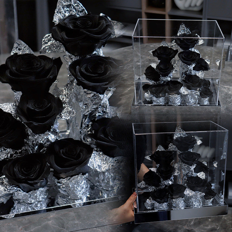 Acrylic flower box with black preserved roses and silver foil decoration in a clear display case for Valentine's Day and Christmas gift