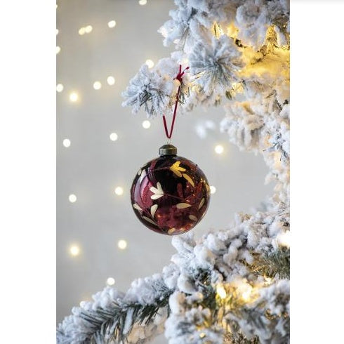 D3.9 Christmas Ball Ornament red glass decorative hanging Christmas tree ornament with gold leaf design on snowy tree branch with warm lights background