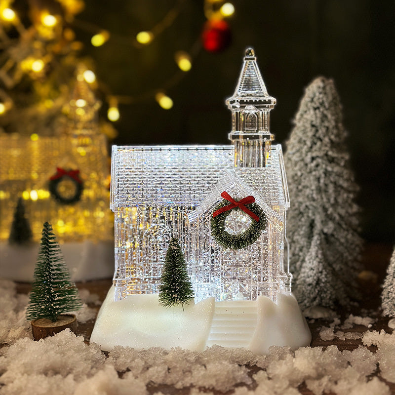 Eve Luminous Crystal House Christmas decoration with light and wreath on snowy surface with miniature trees